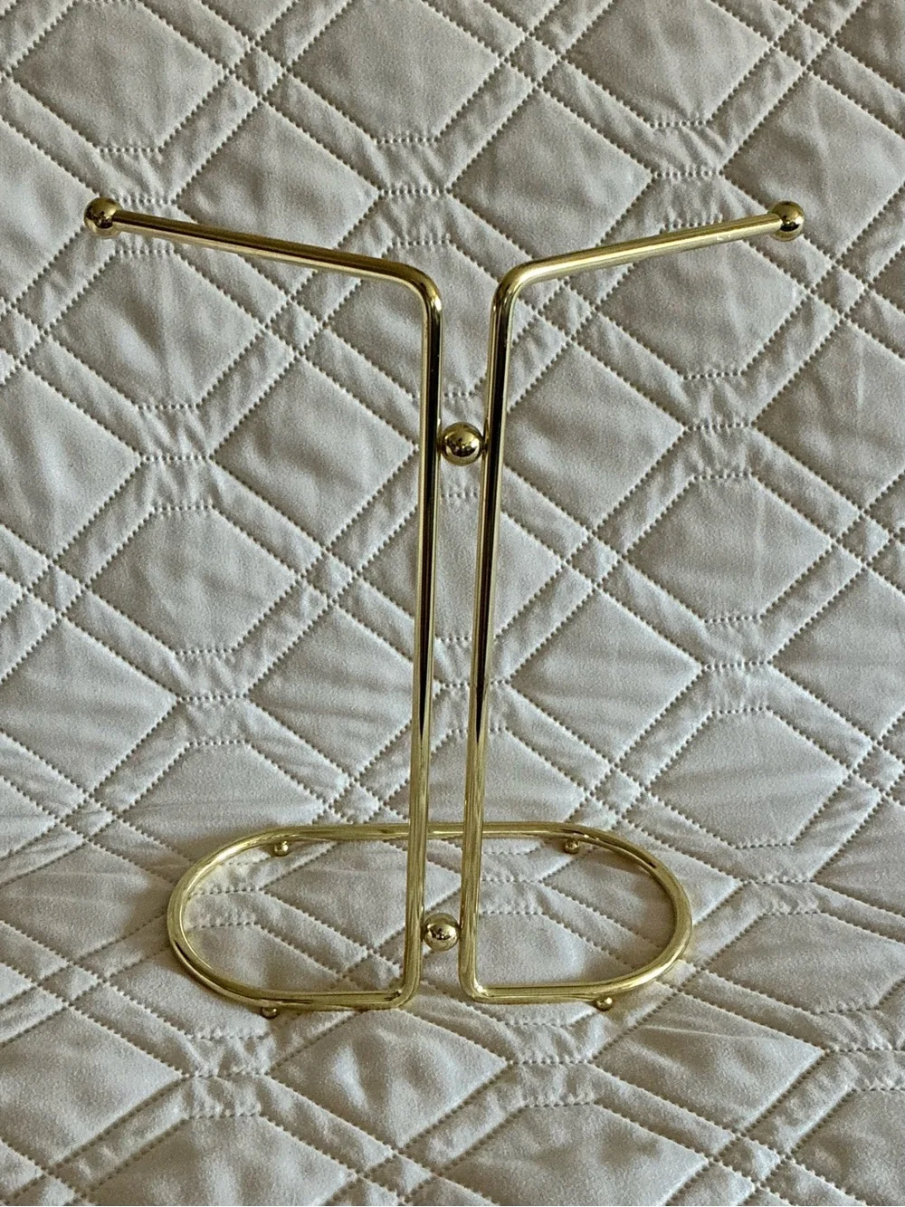 Vintage gold-tone metal countertop vanity hand towel stand